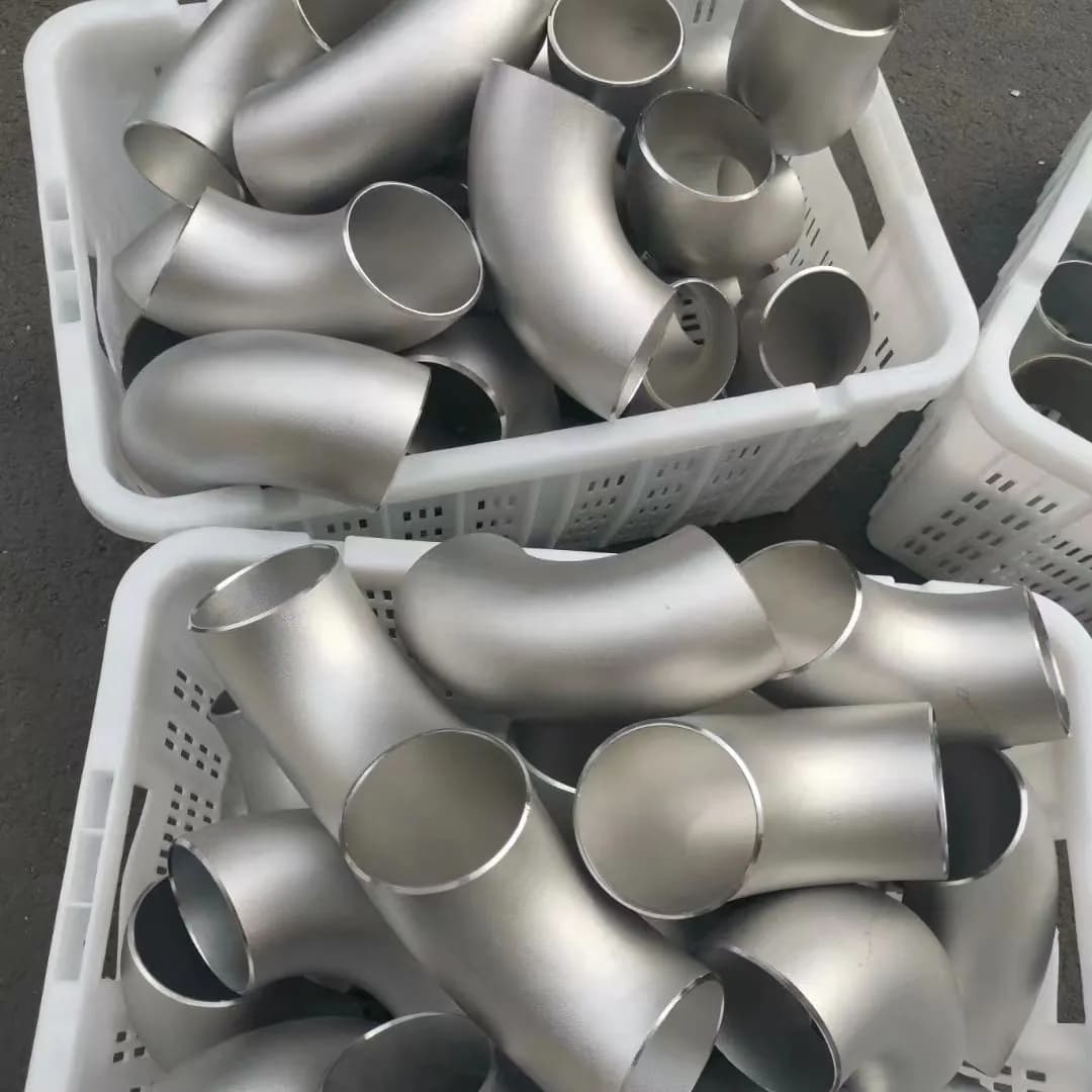 Finished alloy elbows and tees organized in component bins